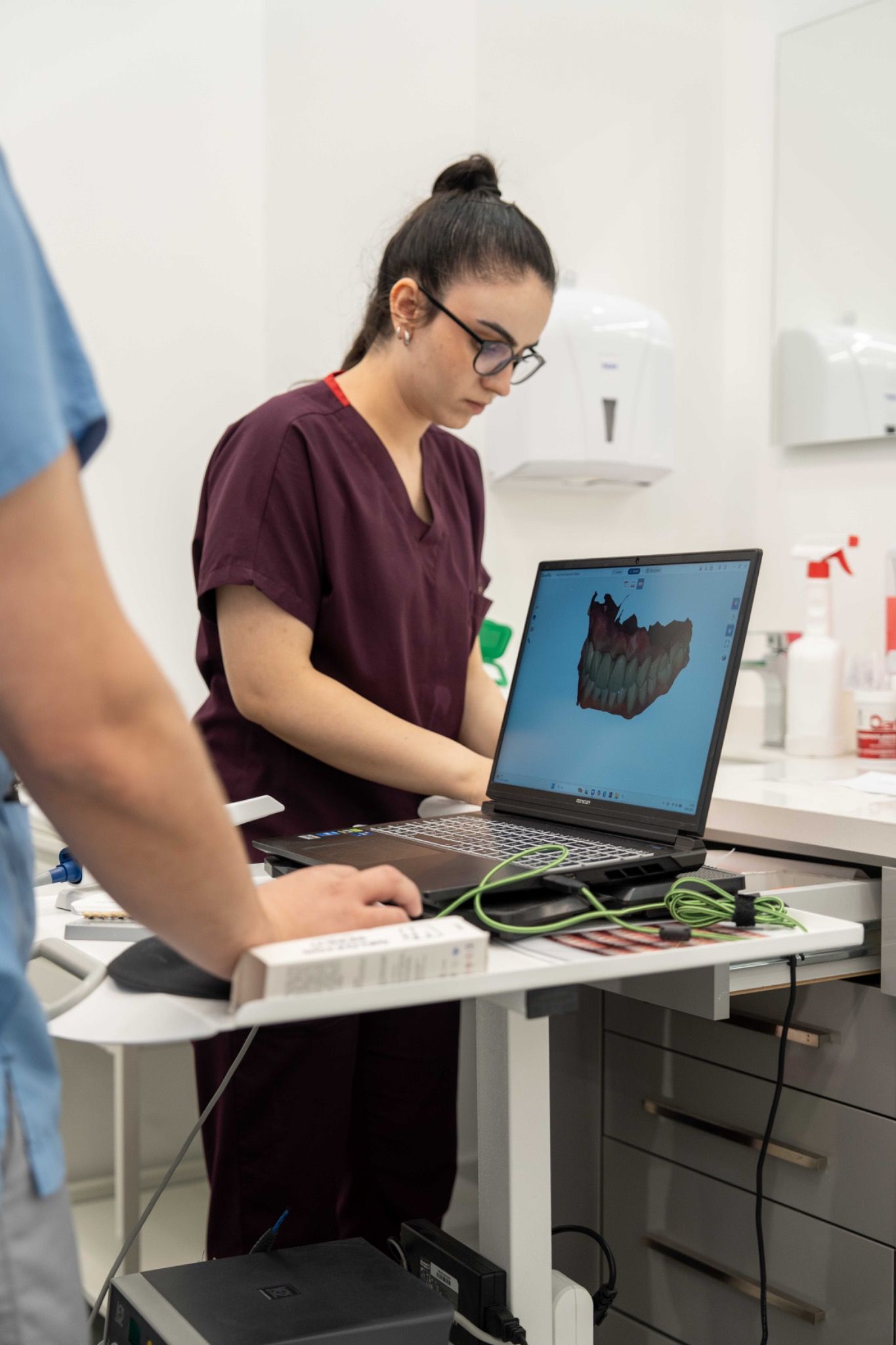A team member reviewing a digital model on a laptop.
